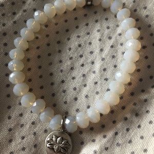 Beaded bracelet with flower charm